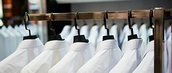 Cleaning white polo shirts — Laundry in Portland, OR Cleaning white polo shirts — Laundry in Portland, OR